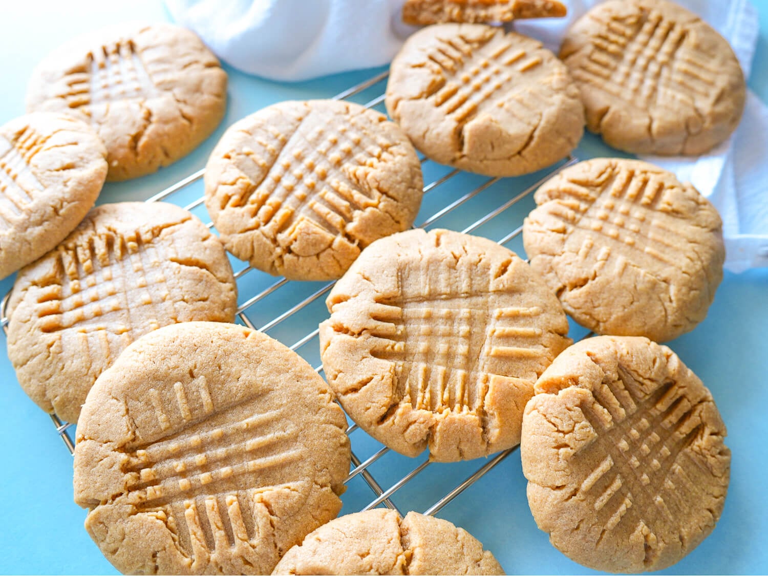 HERO photo of peanut butter cookie resting on a wire rack