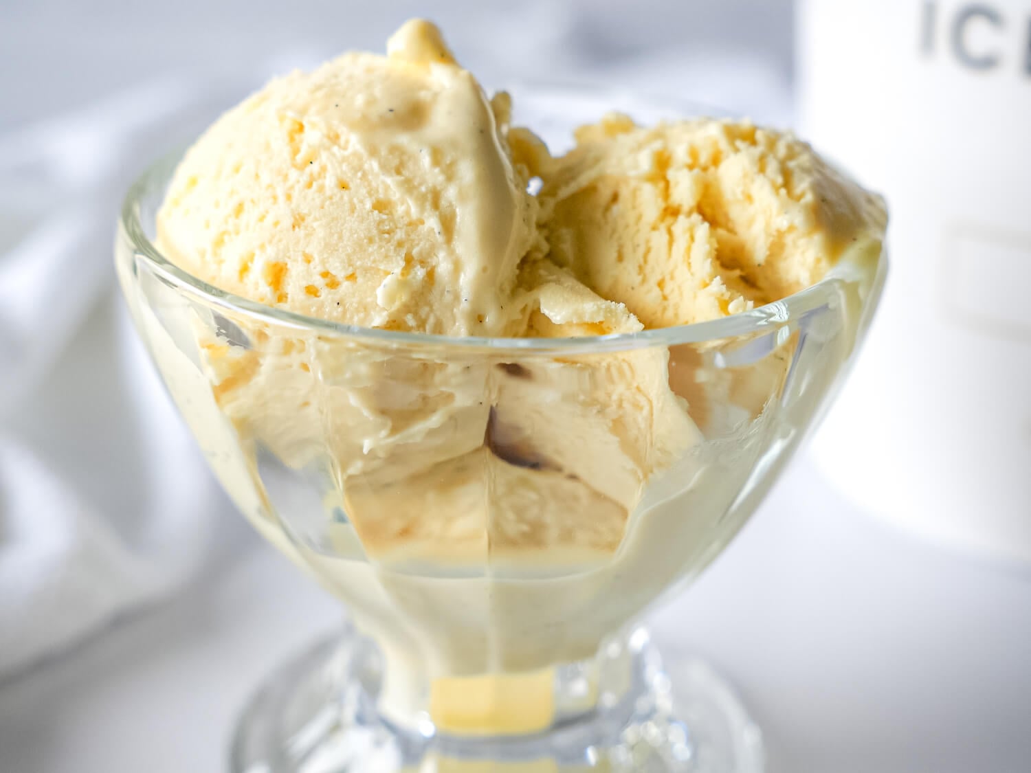 close up photo of French Vanilla Ice Cream in a glass bowl