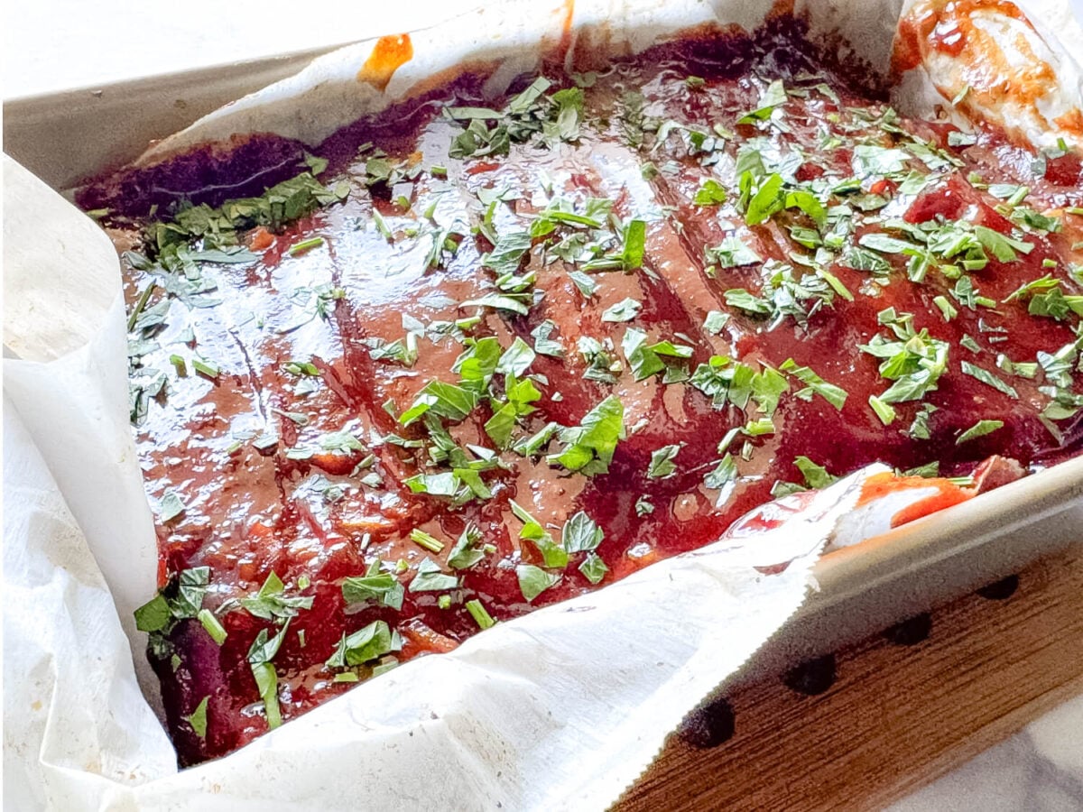 close up photo of meatloaf resting in a pan