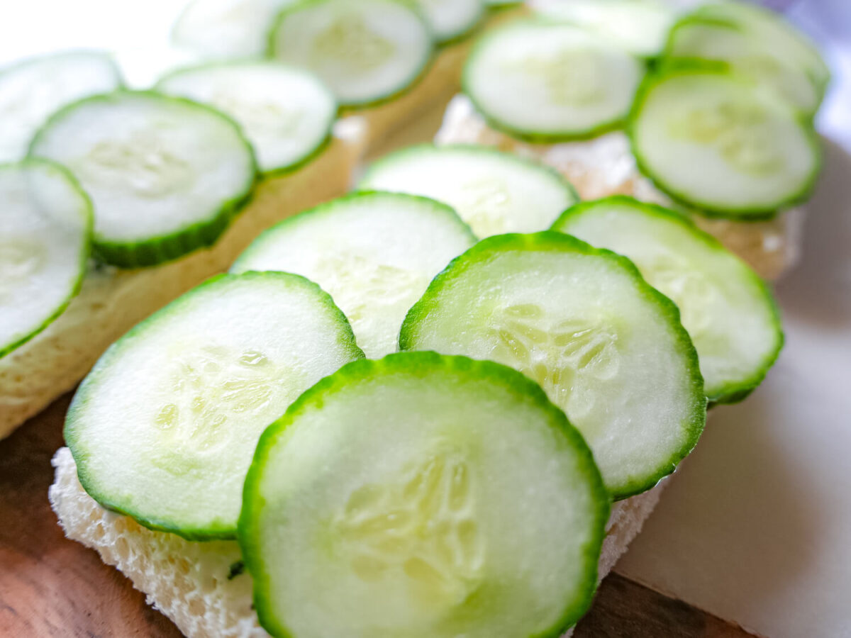 close up photo of sliced cucumbers on bread