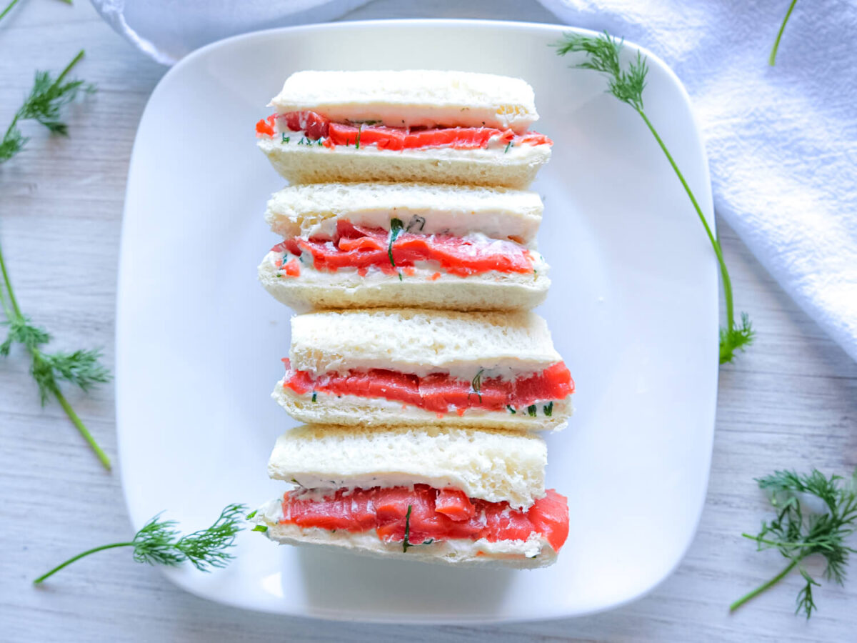 overhead photo of Smoked Salmon Tea Sandwiches on a white plate