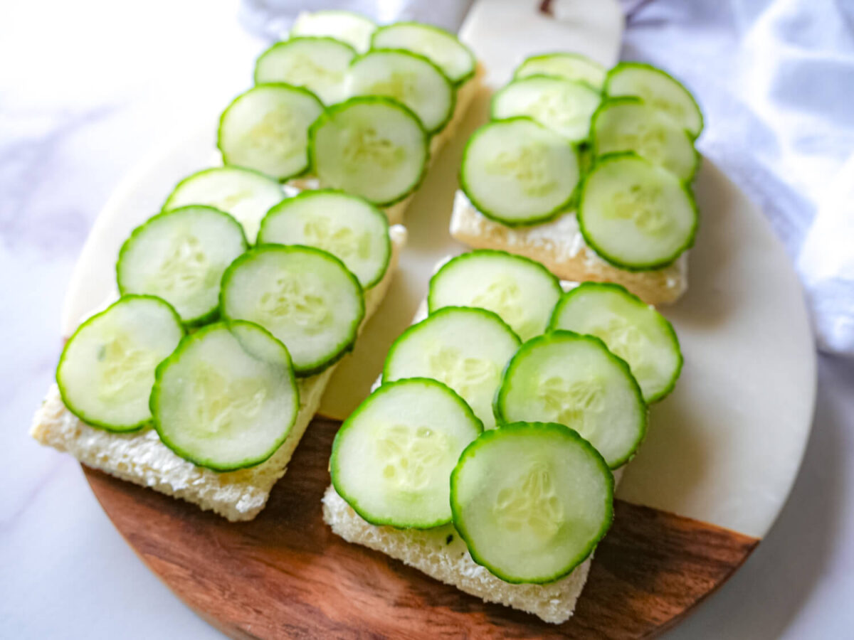overhead photo of cucumber sandwiches on a serving tray