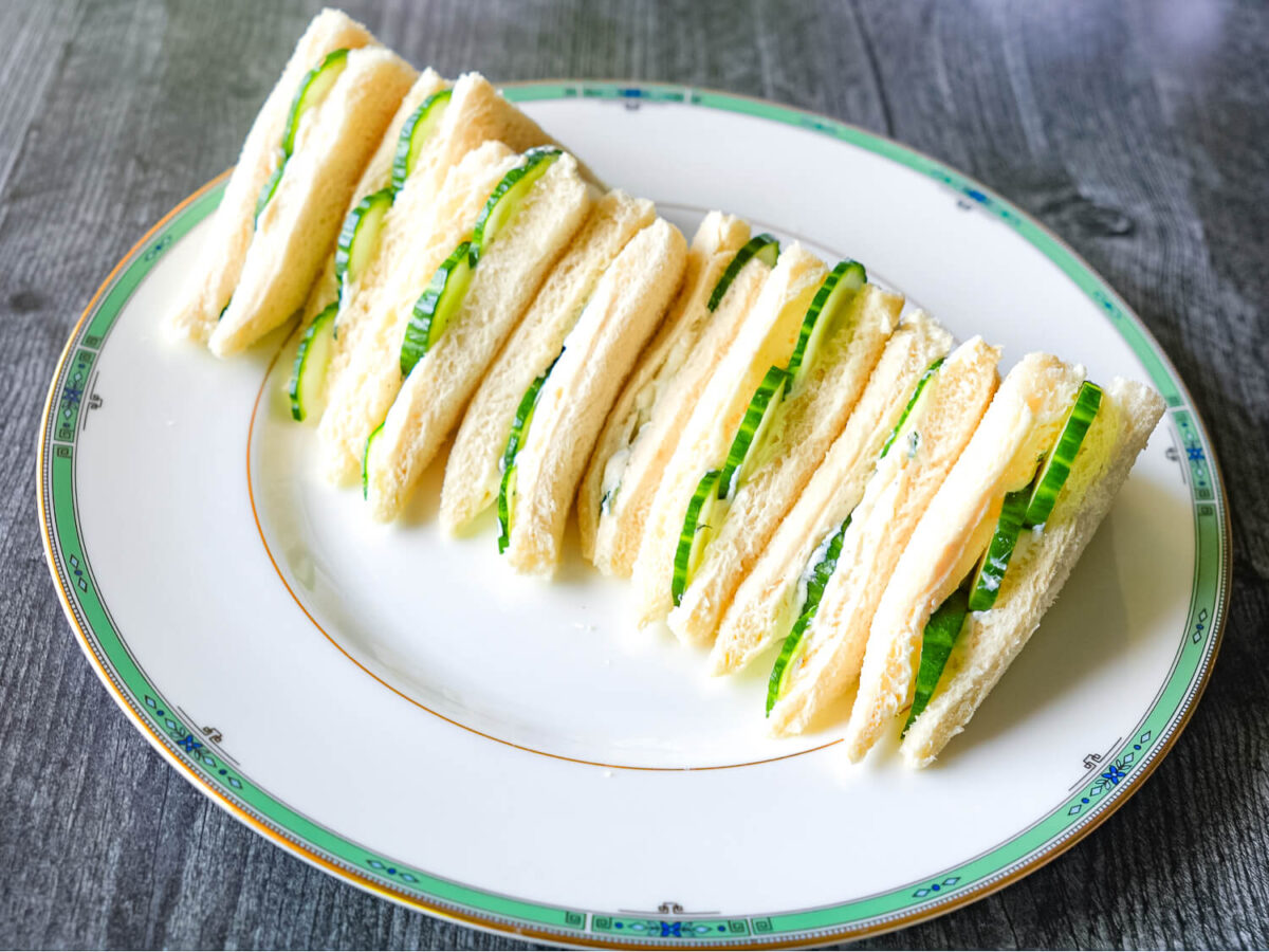 photo of cucumber sandwiches on a china plate