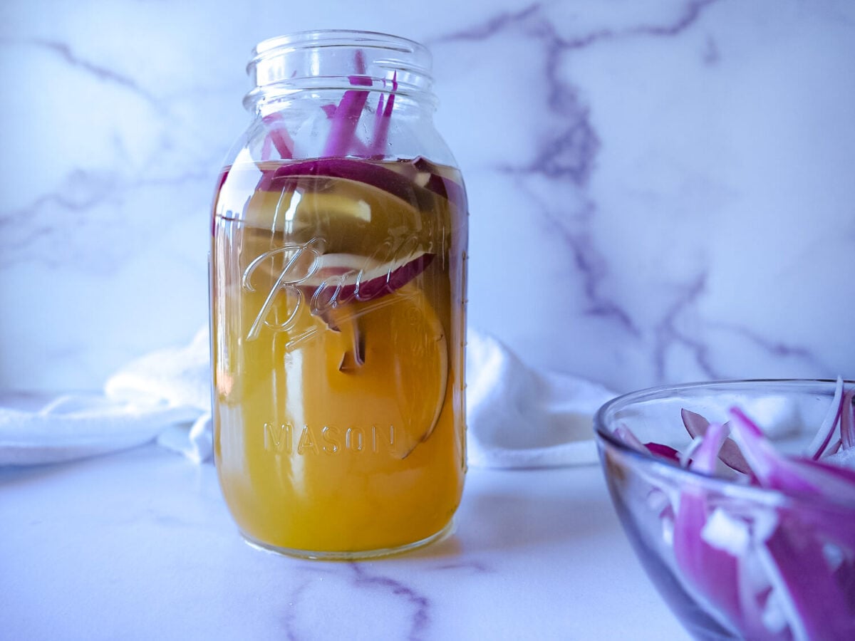 photo of pickled red onions in a mason jar