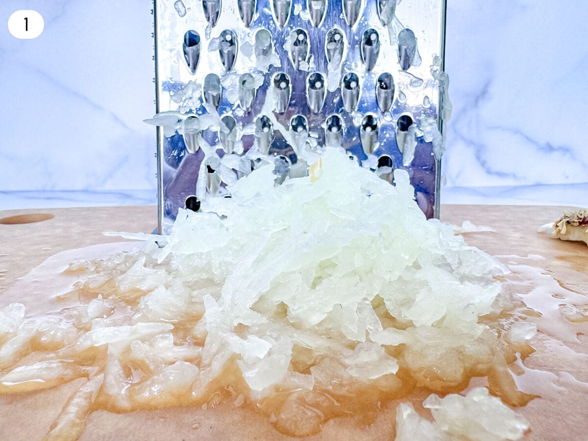 step 1 photo of shredding onions on a grater