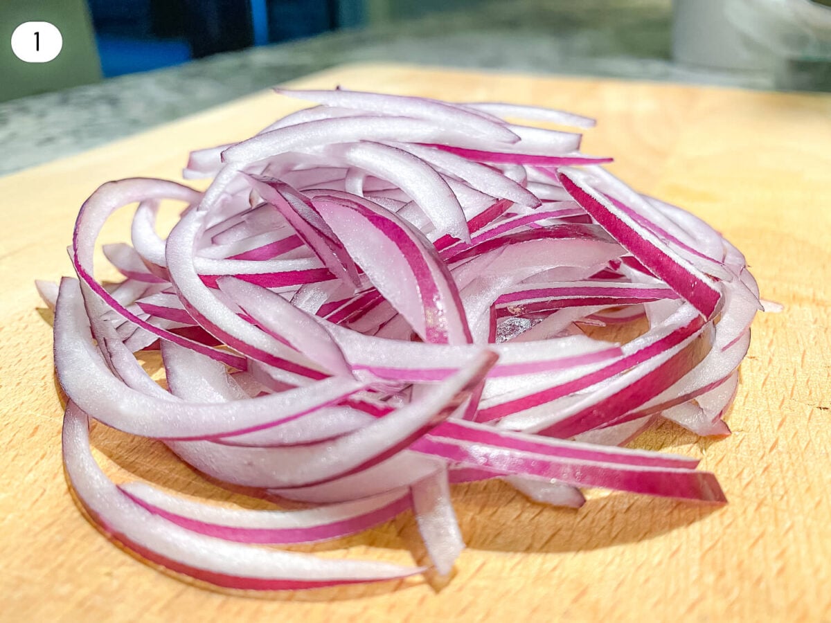 step 1 photo of sliced red onions