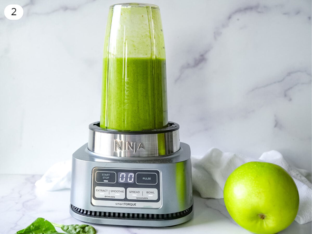 step 2 photo of Pineapple Spinach Smoothie ingredients blending in a blender cup