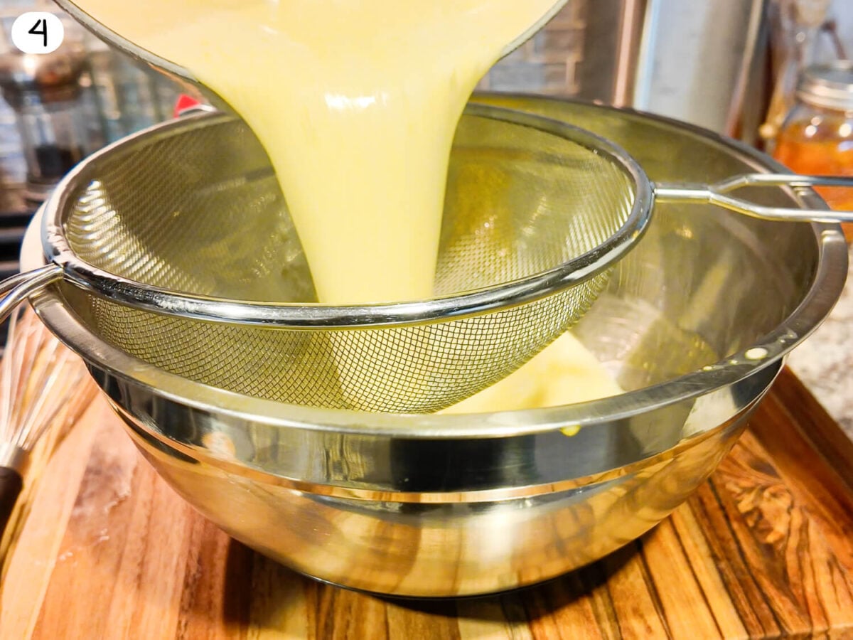 step 4 photo of custard being strained into a clean bowl