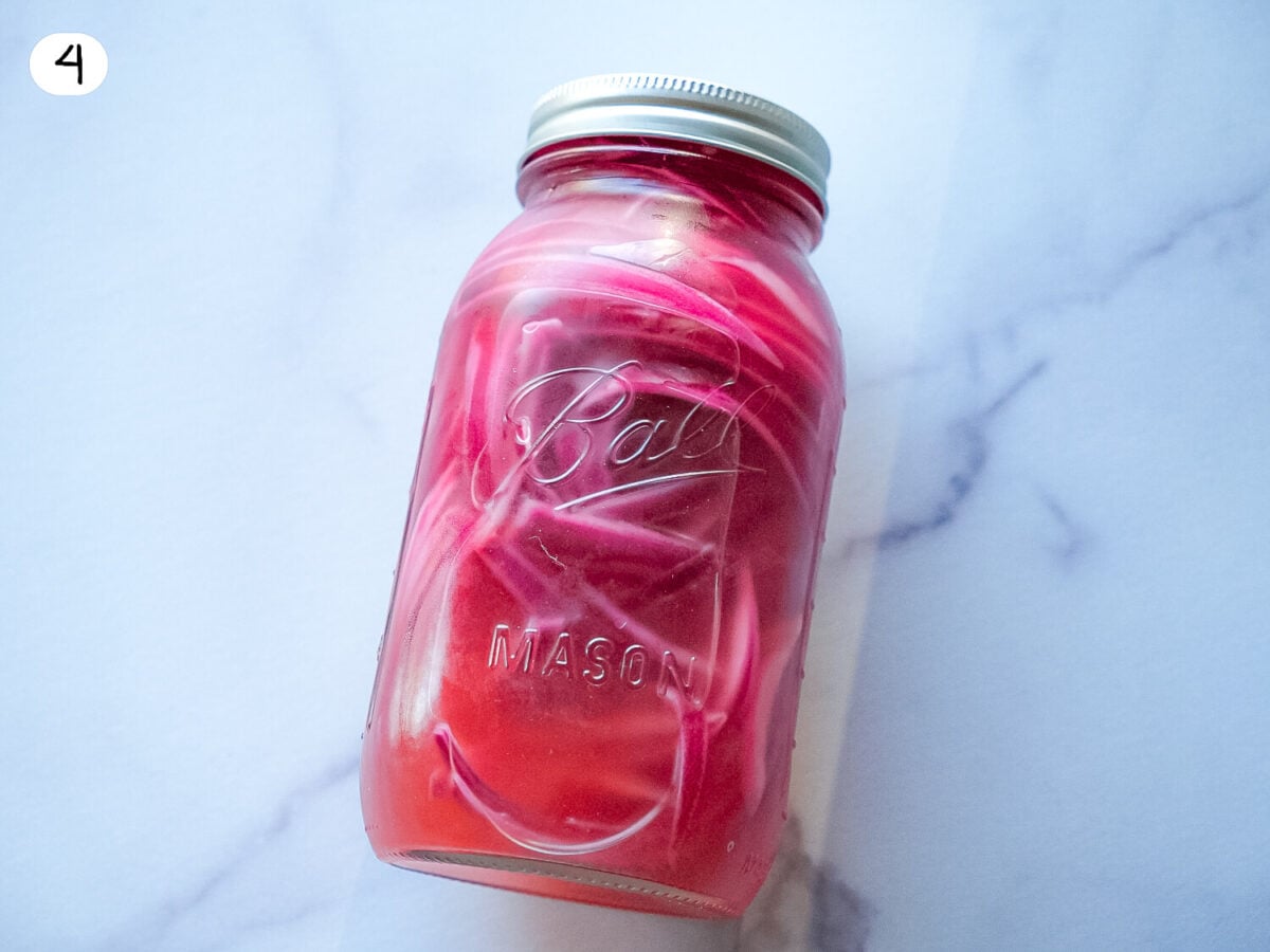 step 4 photo of pickled red onions after being refrigerated