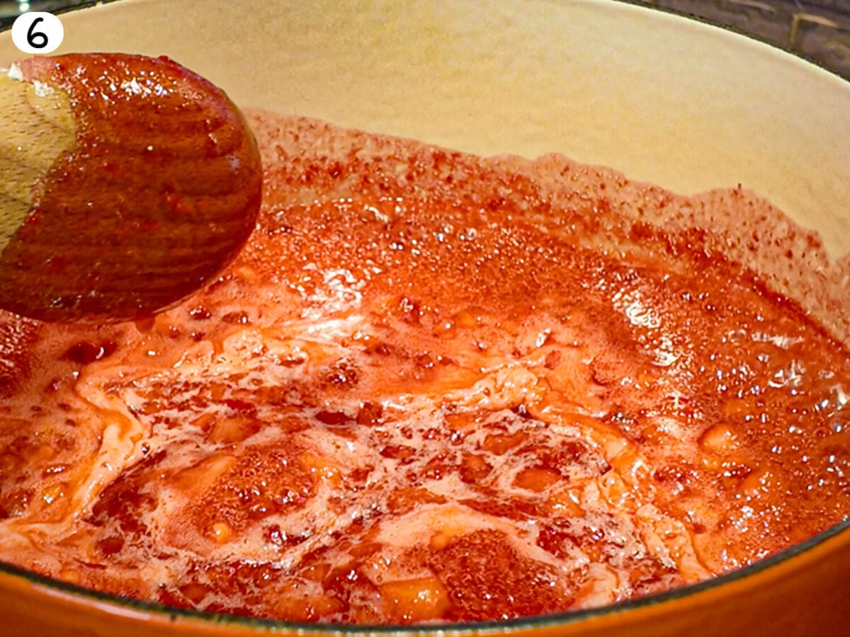 step 6 photo of strawberry jam coming to a rolling boil