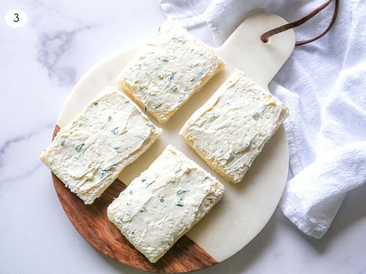 step three photo of cream cheese spread on top of bread