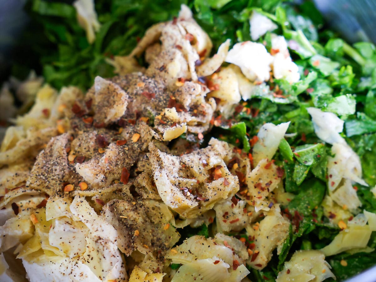 close up photo of Crockpot Spinach and Artichoke Dip seasonings