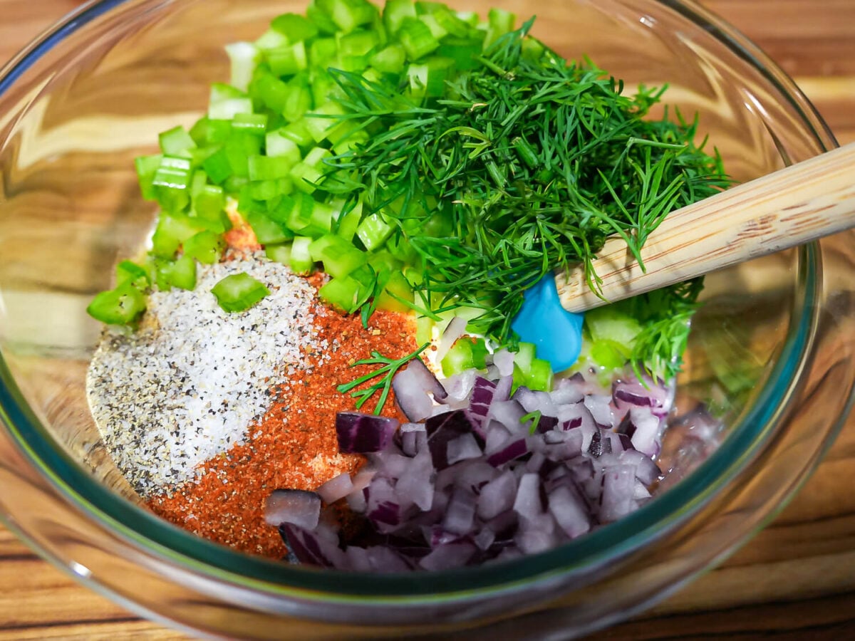 close up photo of Seafood Pasta Salad dressing ingredients in a glass bowl