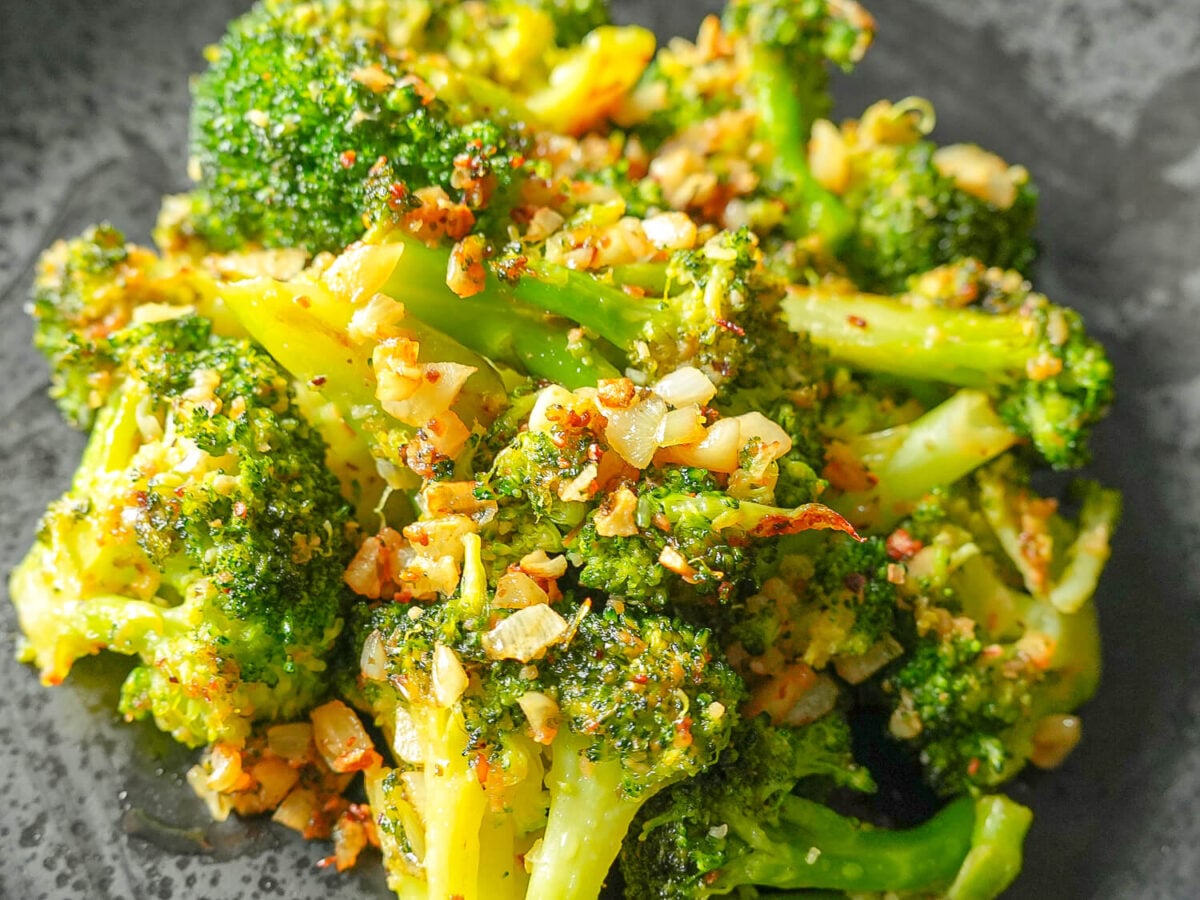 close up photo of garlic on Sautéed Broccoli
