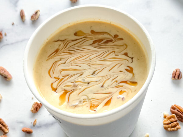 overhead photo of praline ice cream with caramel swirls
