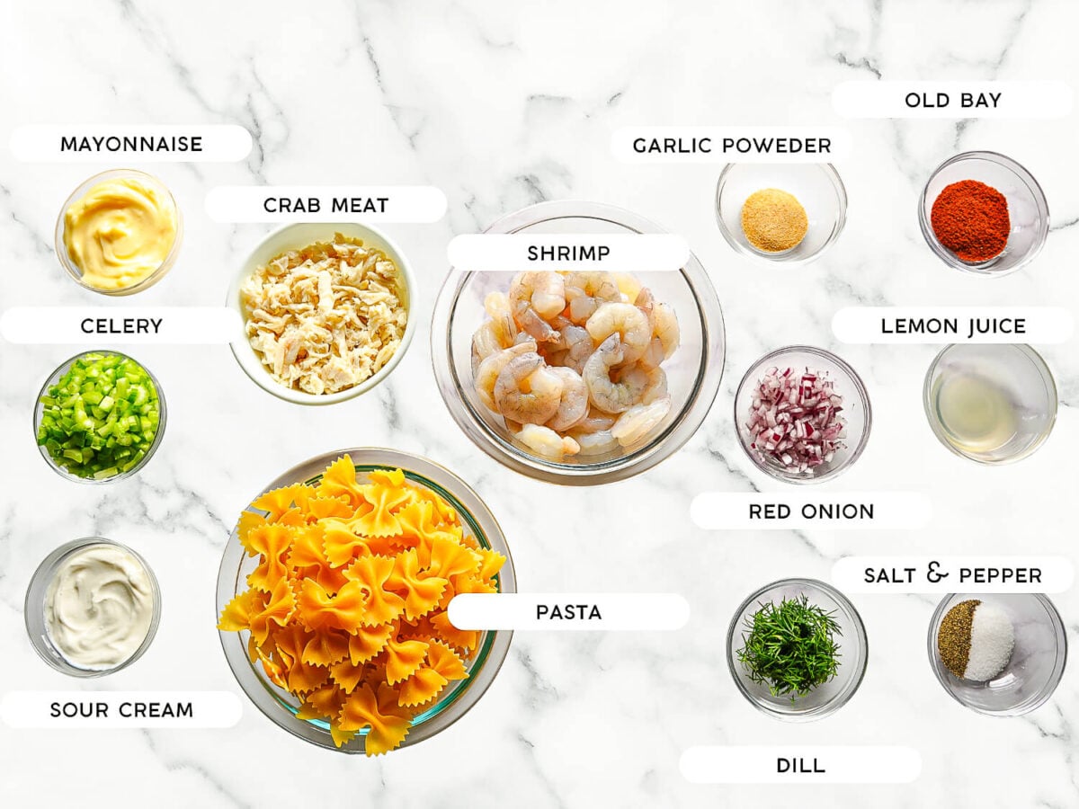 photo of Seafood Pasta Salad ingredients on a marble surface