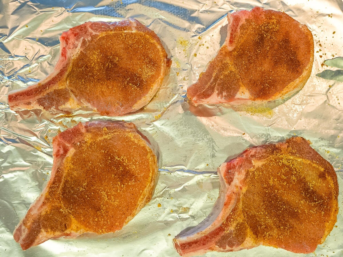 photo shows seasoning on top of the pork chops
