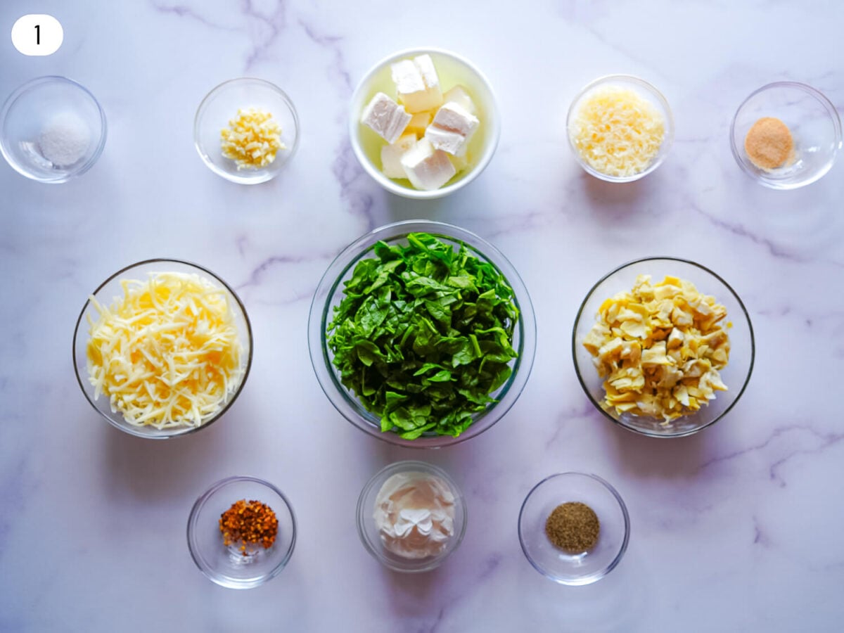 step 1 photo of Crockpot Spinach and Artichoke Dip ingredients that are chopped and prepped
