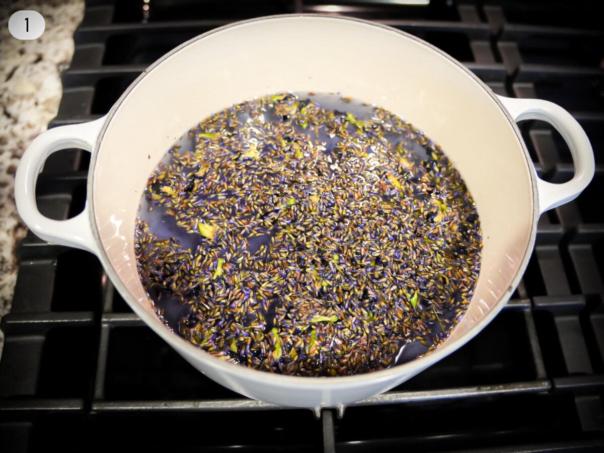 step 1 photo showing lavender flowers steeping to make syrup