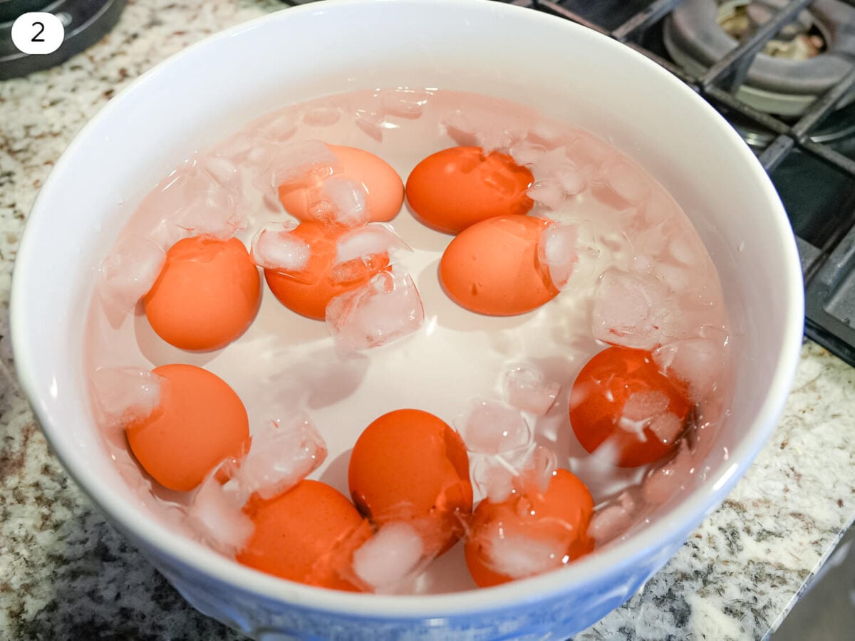 step 2 photo of eggs cooling in an ice bath