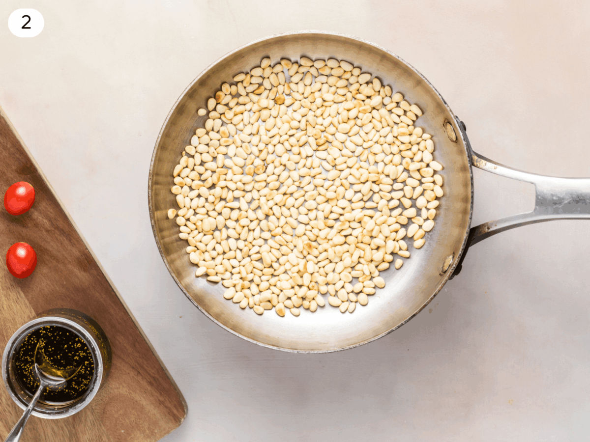 step 2 photo of pine nuts being toasted