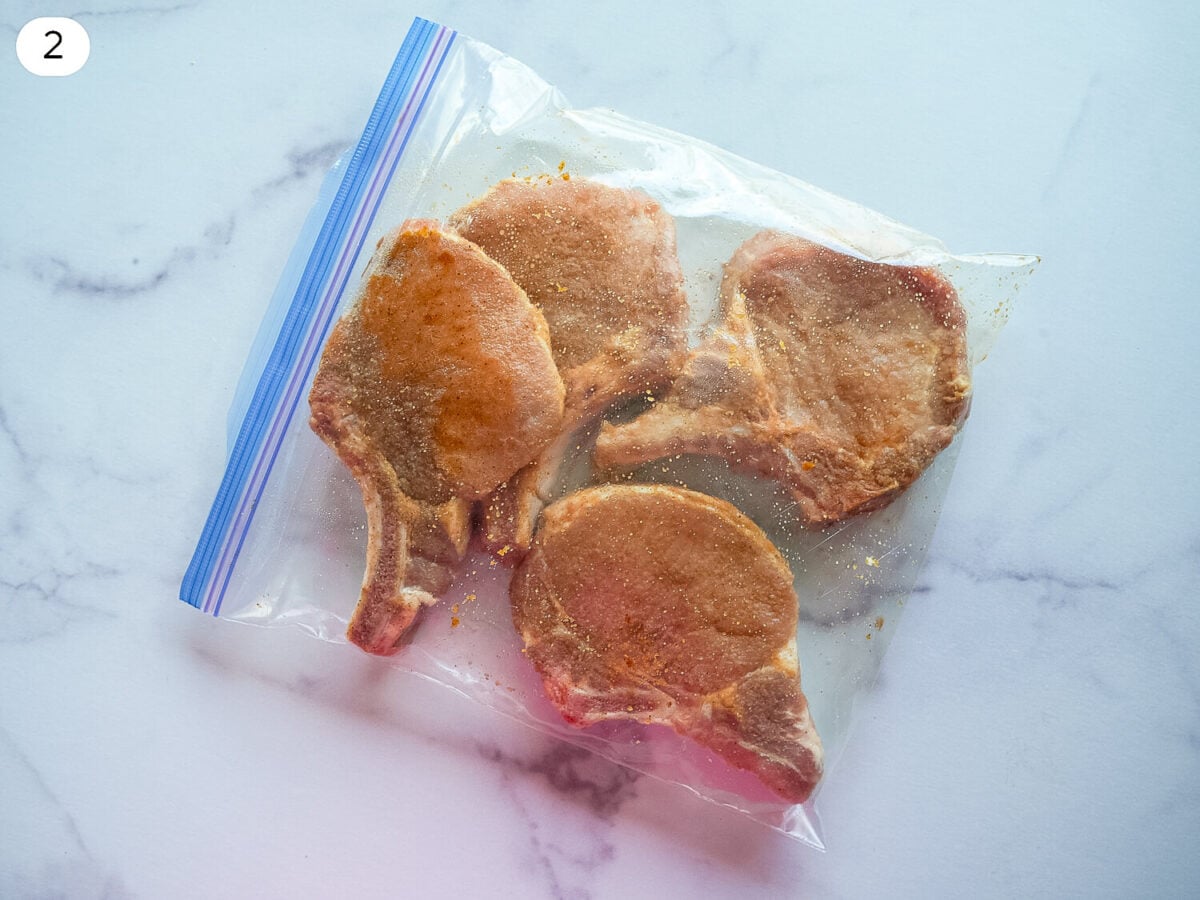 step 2 photo showing the pork chops marinating in a plastic bag