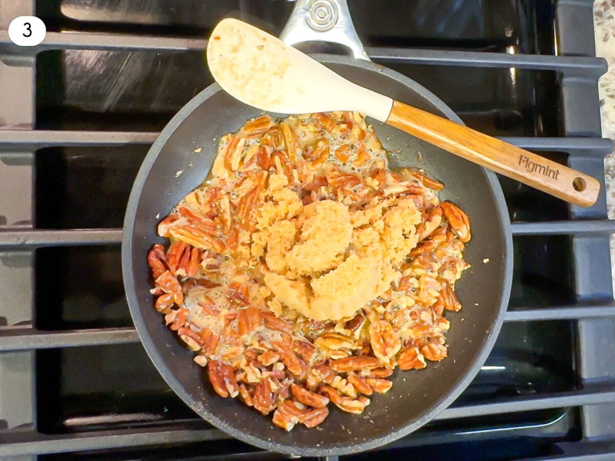 step 3 photo of pecans and butter in a pan on the stove