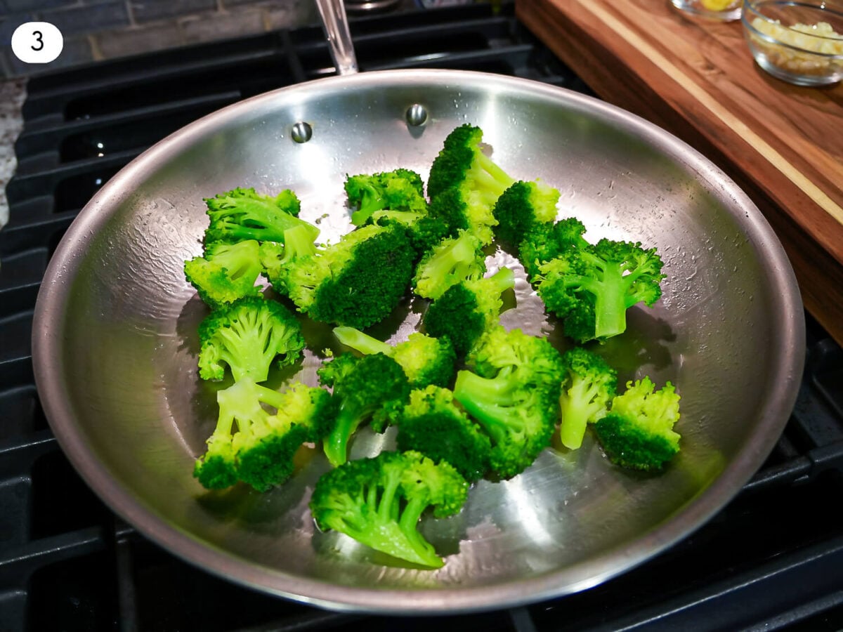 step 3 photo of sautéing broccoli in a pan