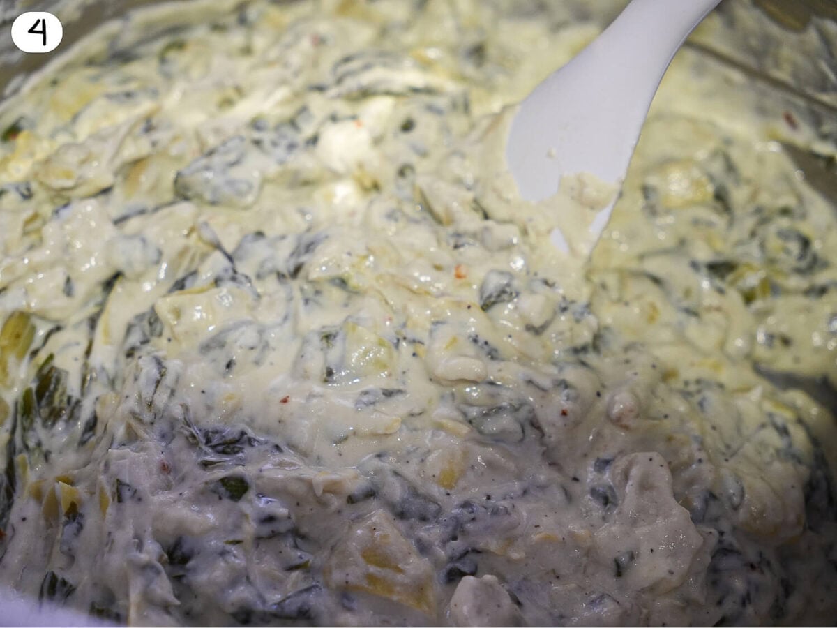 step 4 photo showing close up picture of Crockpot Spinach and Artichoke Dip that is melted and ready to serve