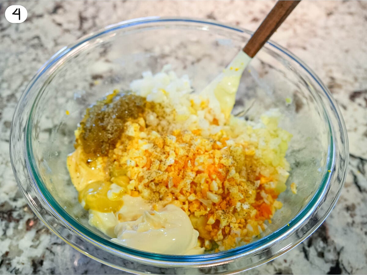 step 4 photo showing potato salad mix ins in a glass bowl