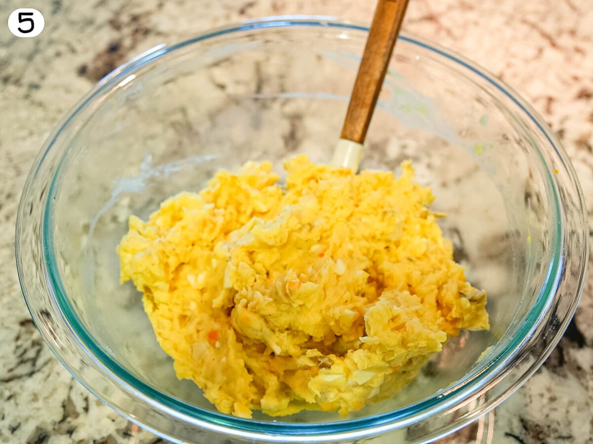 step 5 photo showing mixing of potato salad