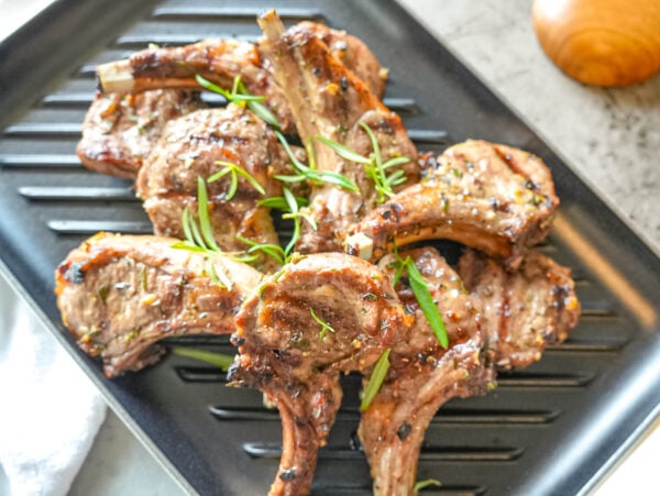 HERO overhead photo of grilled lamb chops on a grill plate