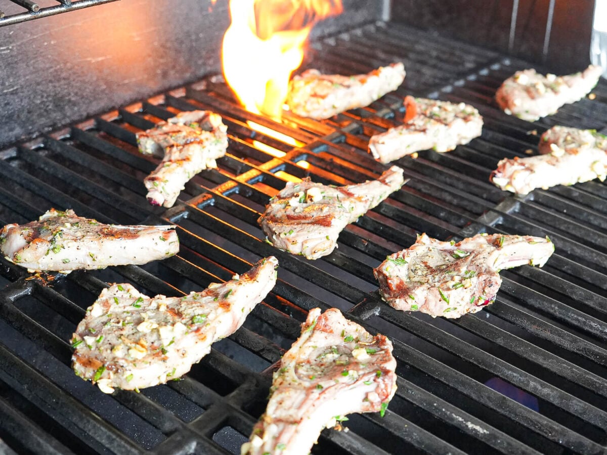 photo of lamb chops on the grill with fire