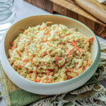 side view of coleslaw in a white bowl