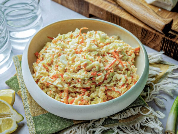 side view of coleslaw in a white bowl