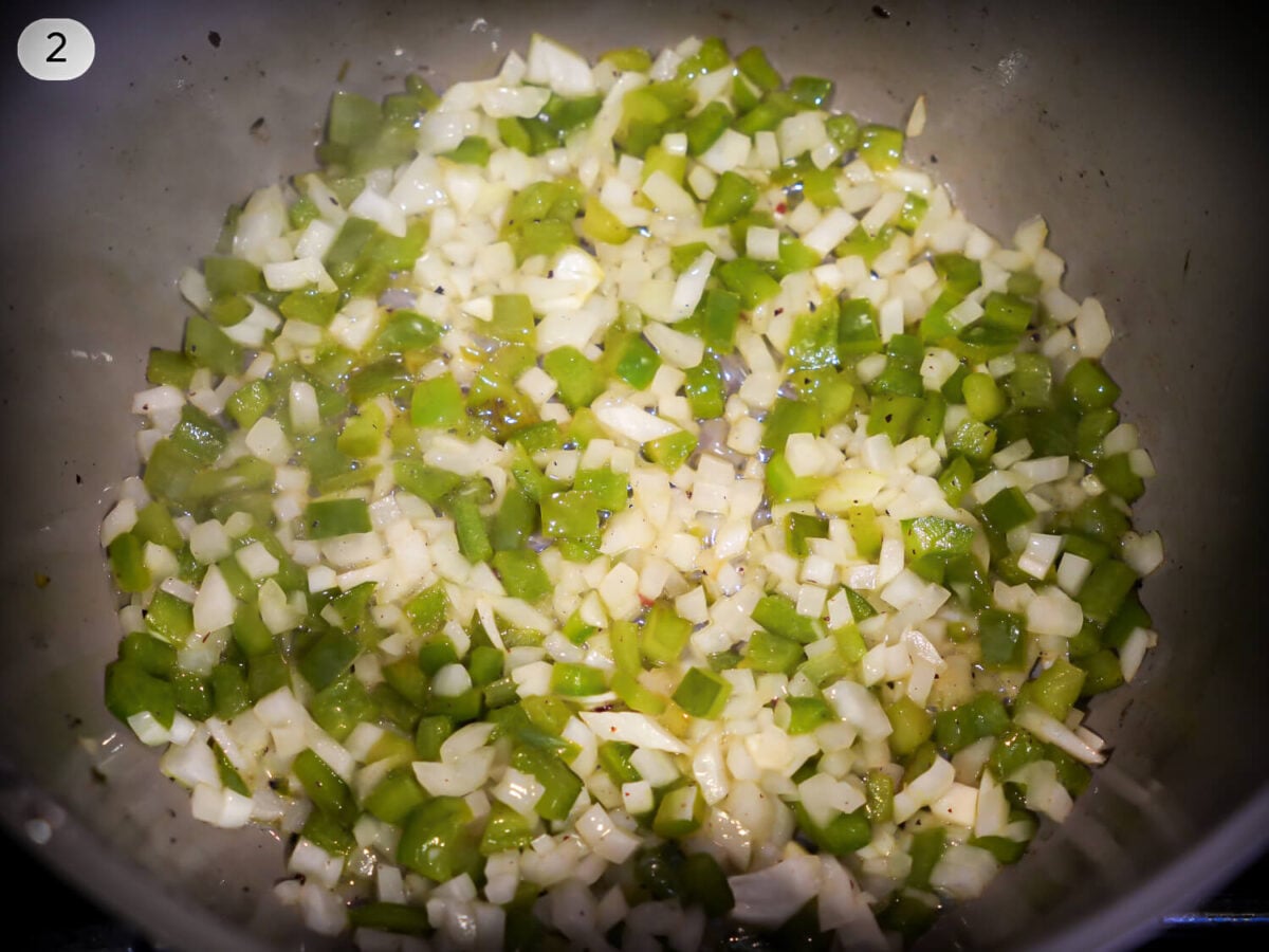 step 2 photo of cooking green bell peppers and onions in a pot