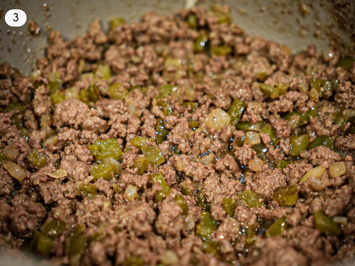 step 3 photo of a close up photo of ground beef cooking in a pot