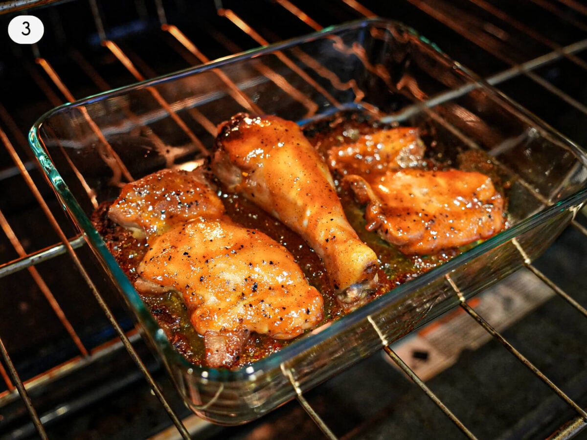 step 3 photo of honey bbq chicken cooking in the oven with sauce on