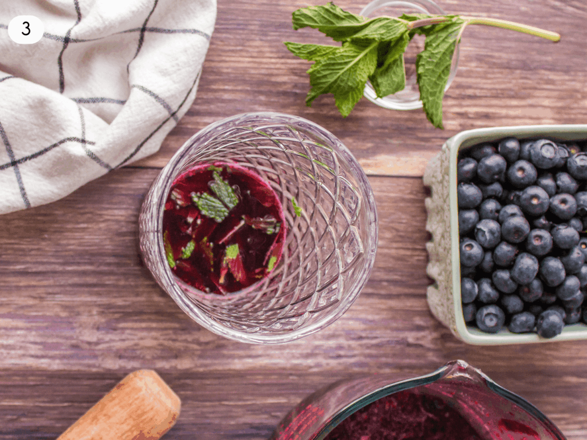 step 3 photo showing blueberry mojito ingredients in a glass shaker