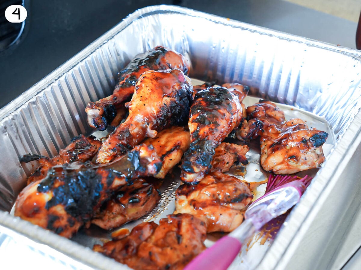 step 4 photo of grilled chicken resting in a metal pan next to the grill