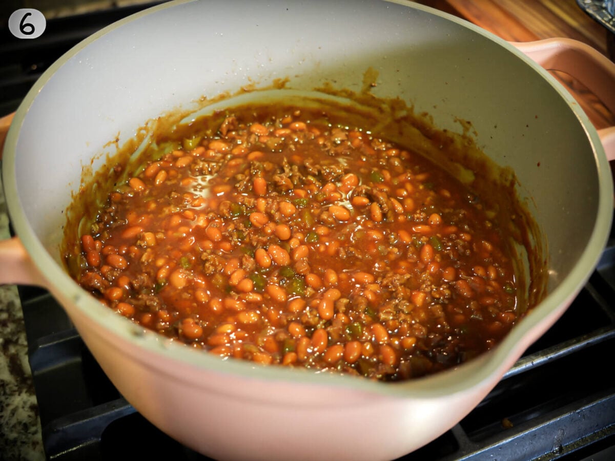 step 6 photo show southern baked beans in a pot with a thicker sauce