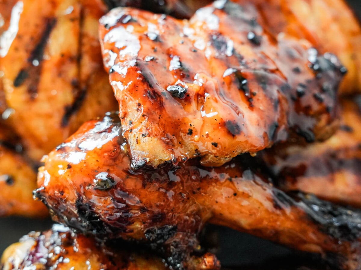 zoomed in photo of a piece of honey barbecue chicken