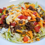 HERO of Big Mac Salad in a white bowl