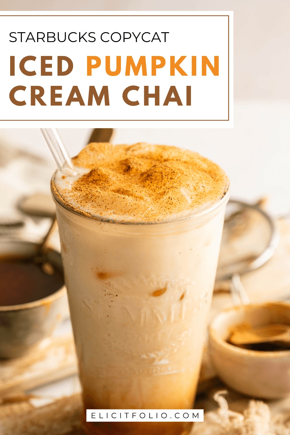 Iced pumpkin cream chai latte topped with creamy cold foam and a dusting of pumpkin pie spice, styled with fall spices and labeled Starbucks Copycat Iced Pumpkin Cream Chai.