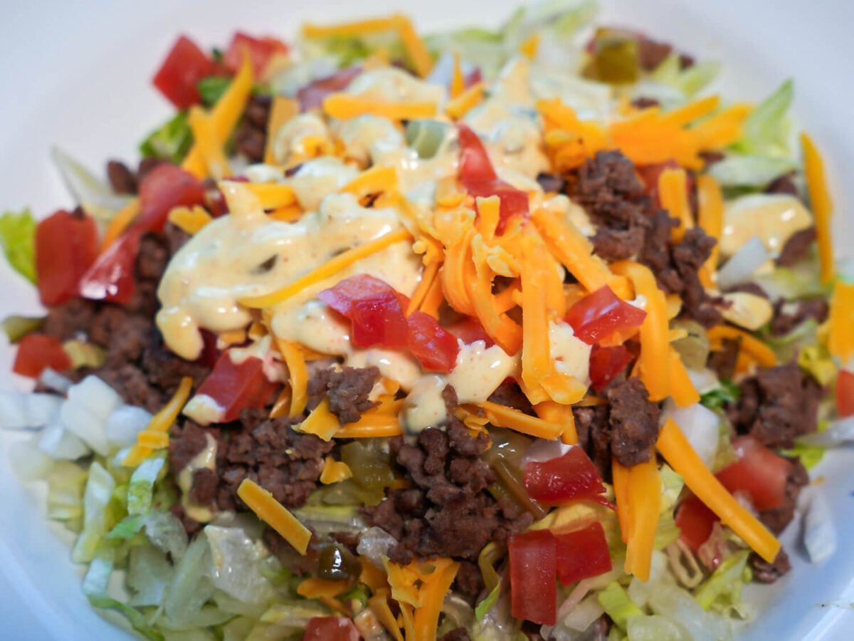 close up photo of Big Mac Salad with big mac salad dressing