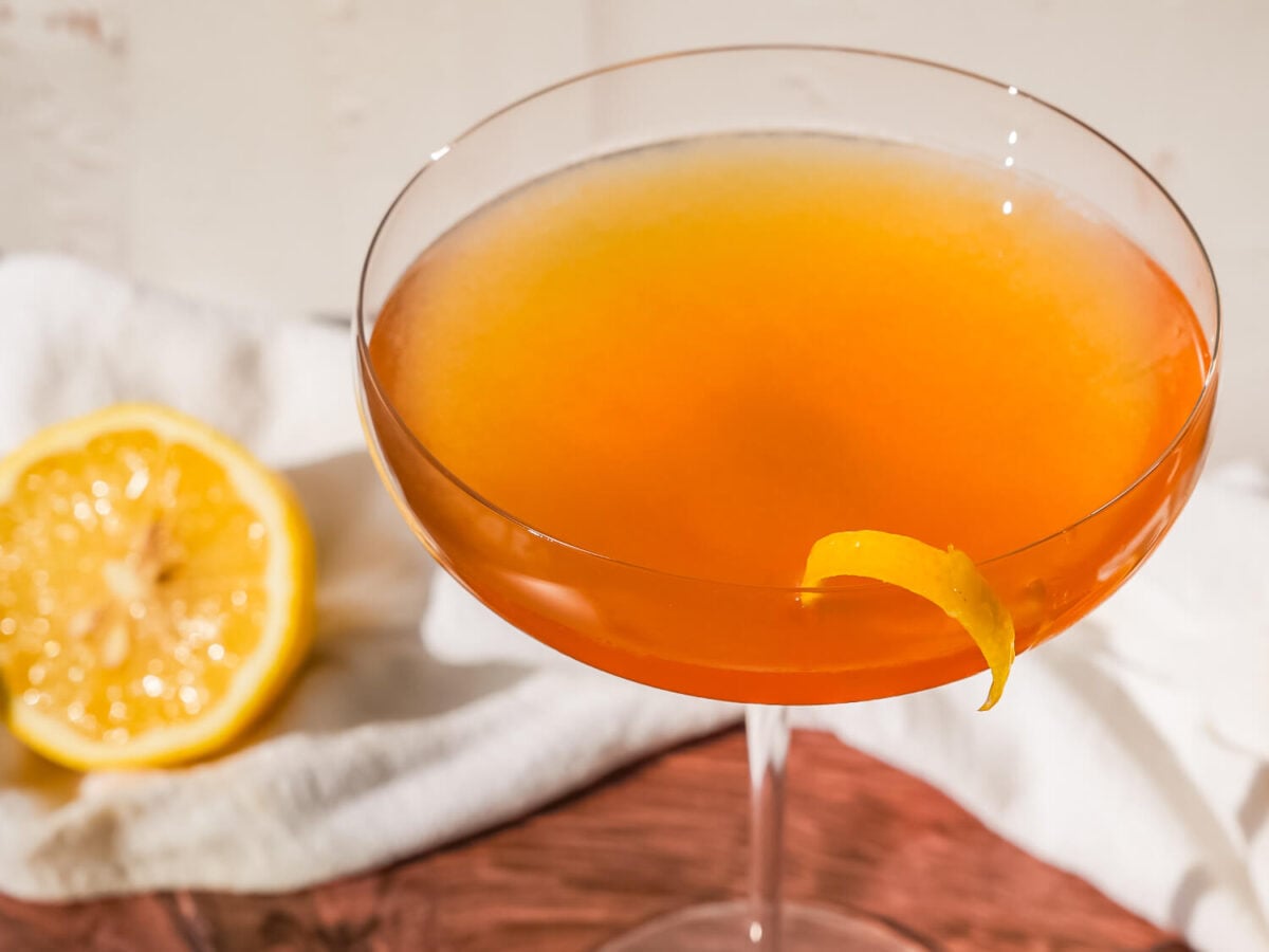 overhead photo of Hennessy Sidecar cocktail with a lemon twist on the side