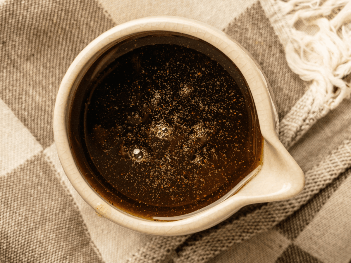 overhead photo of Pumpkin Spice Syrup on a cream blanket