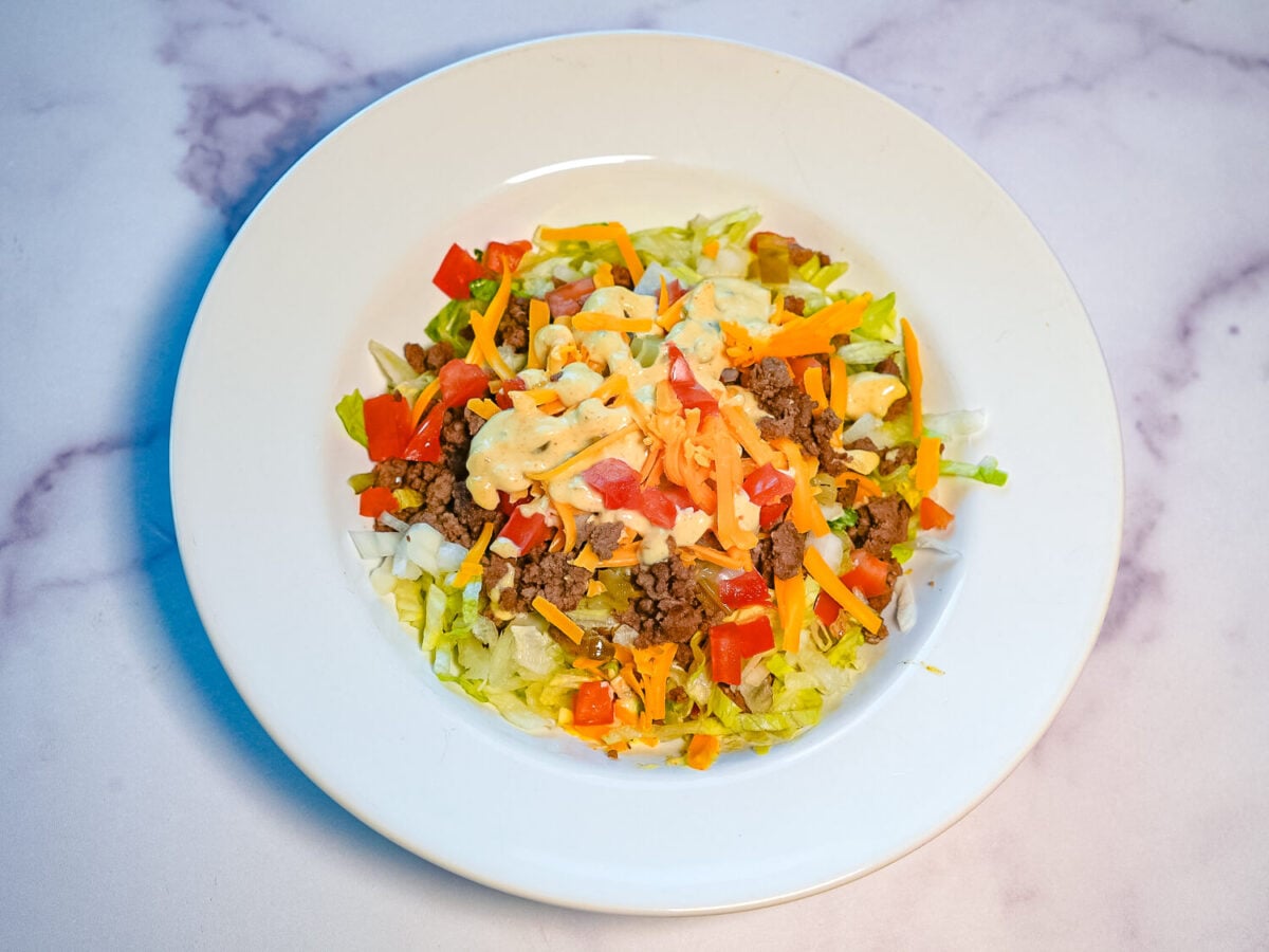 photo of a Big Mac Salad on a marble surface