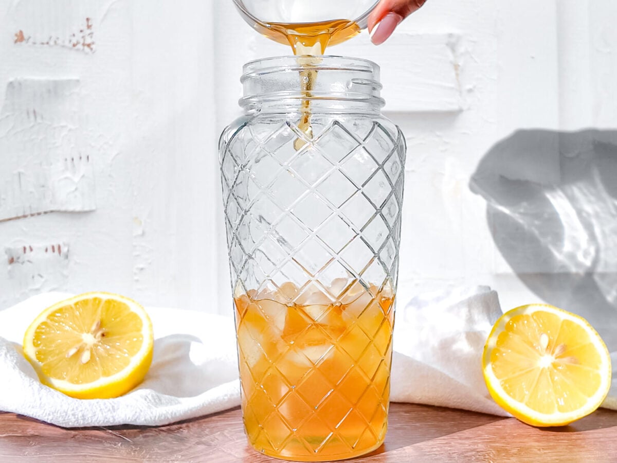 photo showing Demerara syrup being poured into a cocktail shaker 2