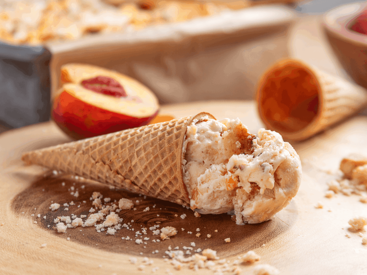 photo showing peach cobbler Ice Cream in an ice cream cone